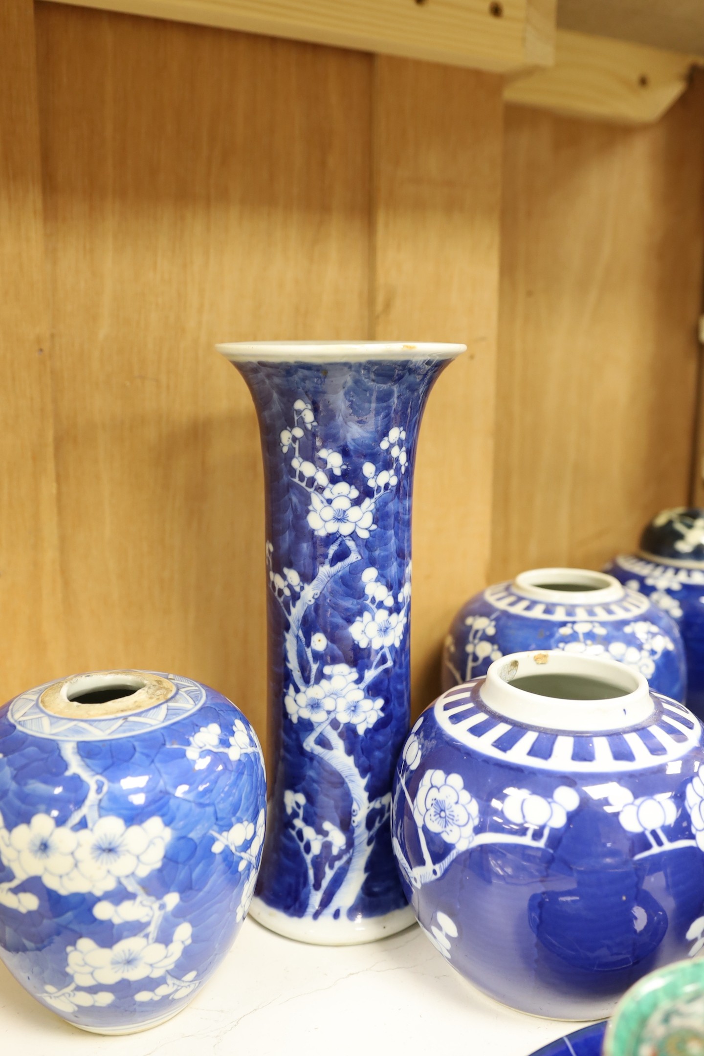 Eight Chinese blue and white ginger jars, one prunus vase and two others, the vase 25 cm high